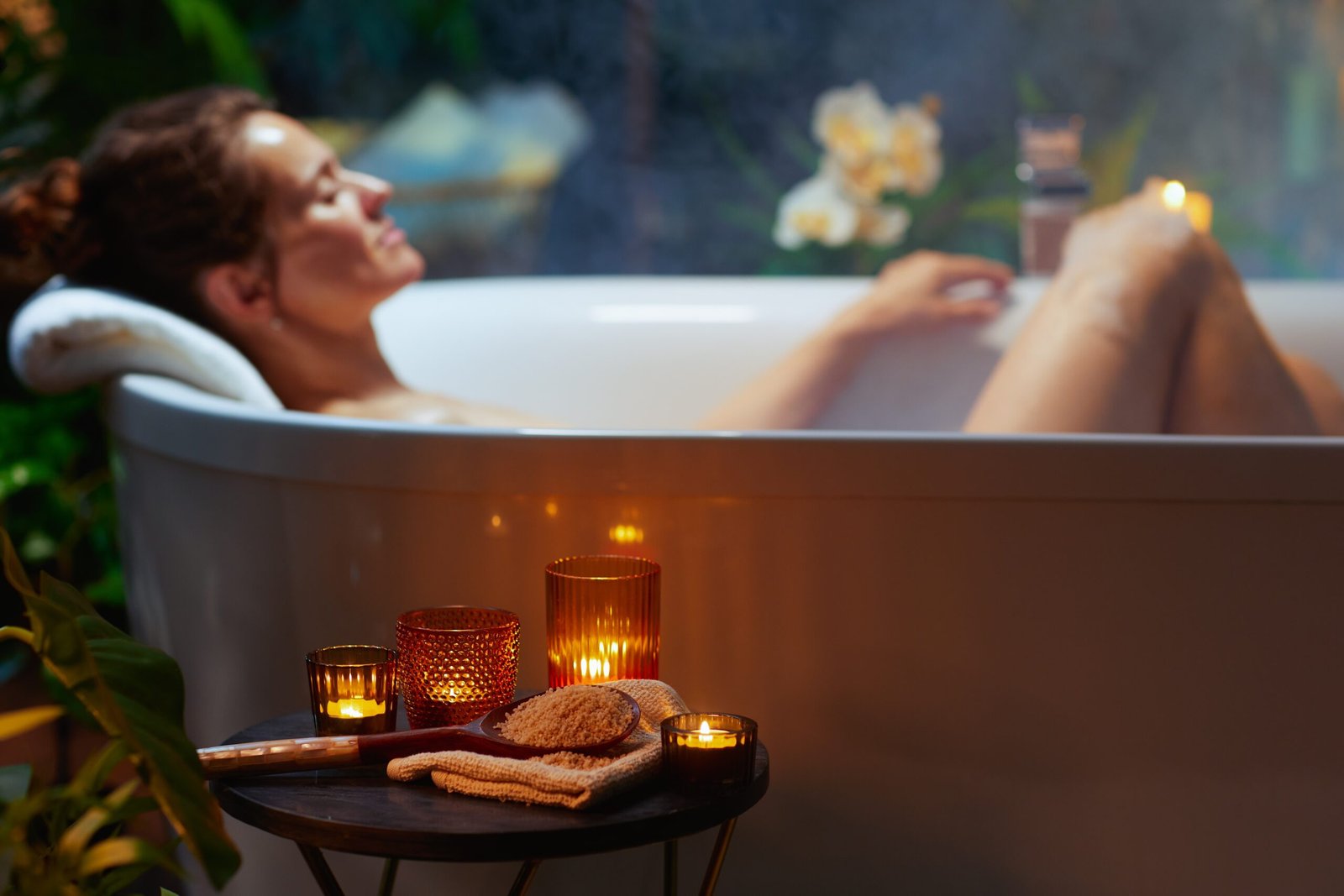 A,Woman,With,A,Bun,Relaxes,In,A,Steam-filled,Bathtub,